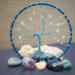 blue and white swirls give this tree the look of refreshing peppermint. It is adorned with glass crystal beads